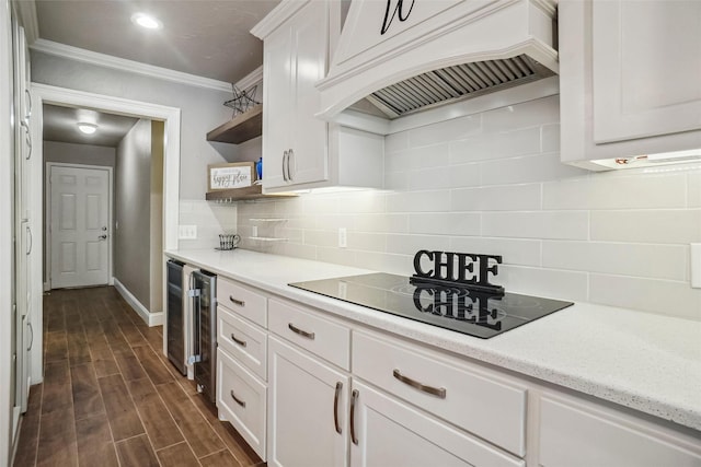 kitchen with open shelves, black electric cooktop, baseboards, custom exhaust hood, and white cabinetry