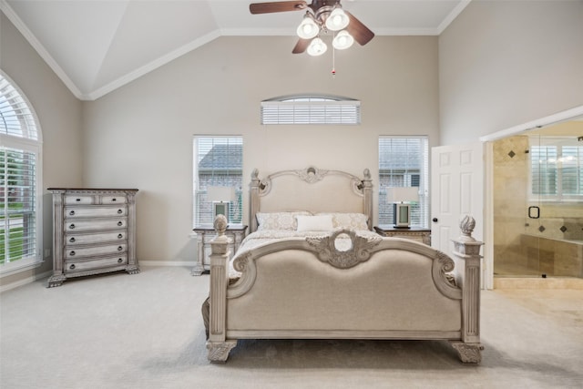 carpeted bedroom featuring high vaulted ceiling, multiple windows, baseboards, and connected bathroom