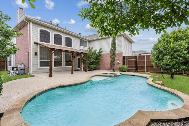 view of pool with a patio, a pool with connected hot tub, and a fenced backyard
