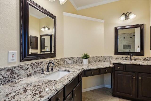 bathroom featuring crown molding, tile patterned floors, tiled shower, and vanity