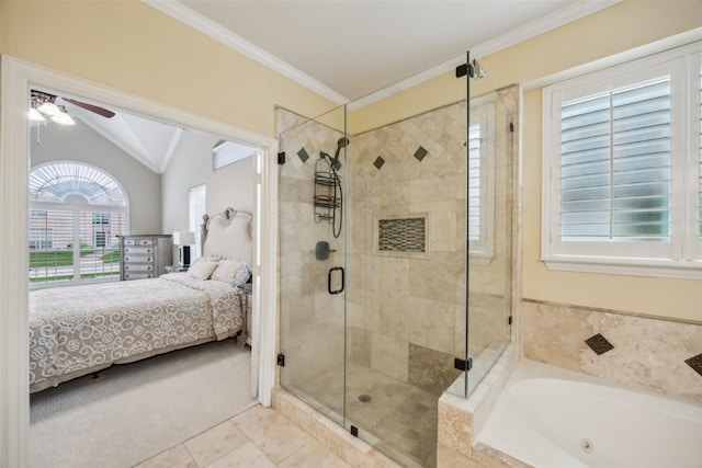 bathroom with ceiling fan, tile patterned flooring, vaulted ceiling, a stall shower, and ensuite bathroom