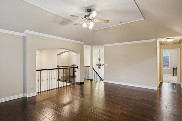 empty room with ceiling fan with notable chandelier, attic access, hardwood / wood-style floors, and lofted ceiling