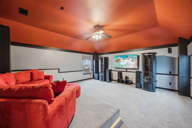 home theater room with visible vents, baseboards, ceiling fan, carpet, and vaulted ceiling