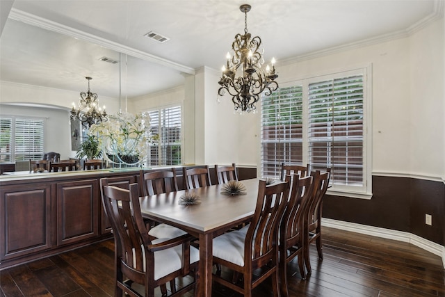 dining area featuring an inviting chandelier, baseboards, dark wood finished floors, and visible vents