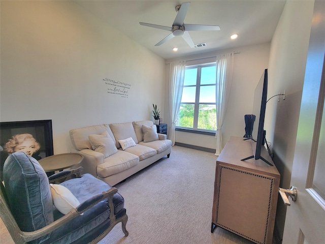 living area with ceiling fan, recessed lighting, visible vents, and light colored carpet