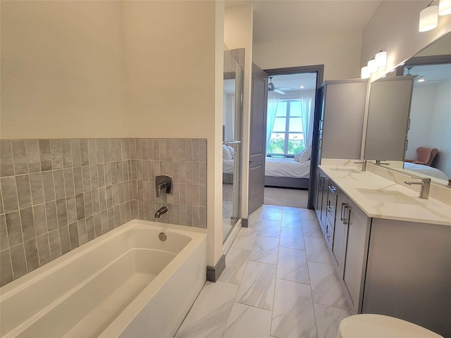 ensuite bathroom with a garden tub, a sink, marble finish floor, and ensuite bath