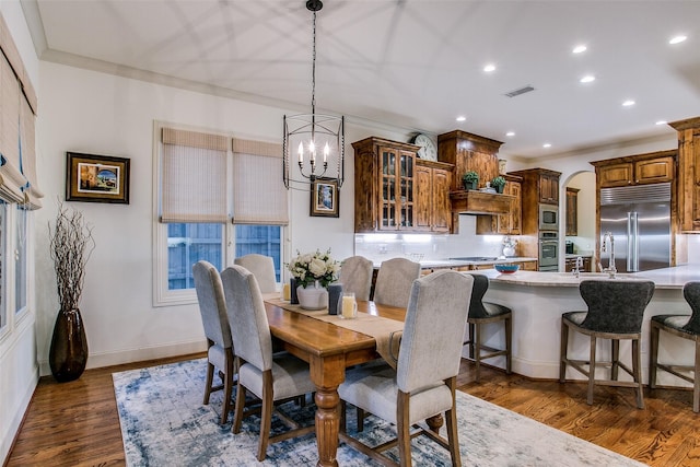 dining room featuring an inviting chandelier, dark wood-style flooring, recessed lighting, and visible vents