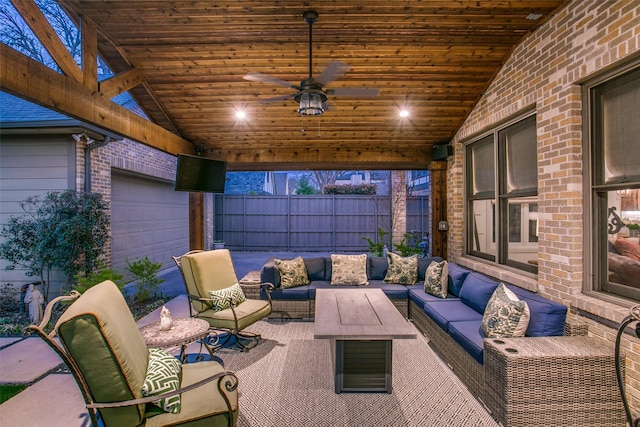 view of patio / terrace featuring an outdoor living space, a ceiling fan, and fence