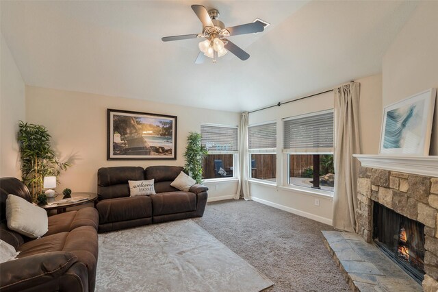 carpeted living area featuring vaulted ceiling, ceiling fan, and baseboards