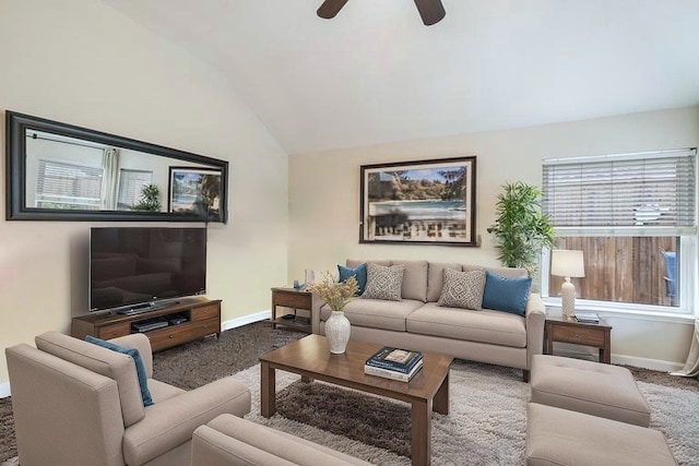 living area with carpet floors, baseboards, lofted ceiling, and a ceiling fan
