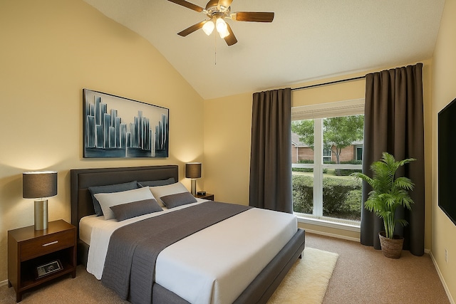 spare room featuring carpet, a ceiling fan, baseboards, and lofted ceiling