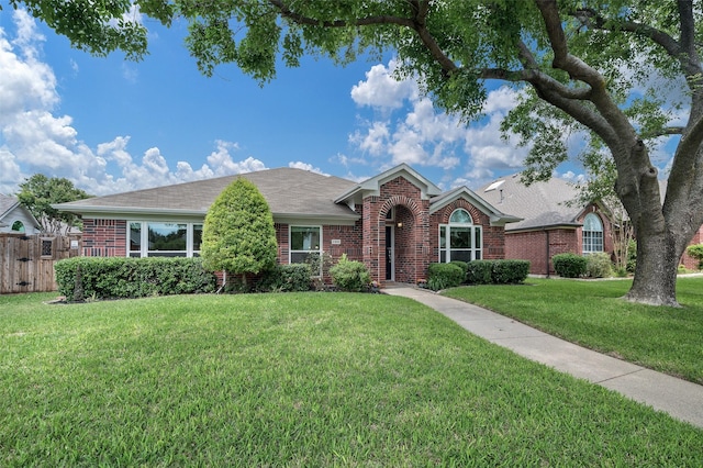 ranch-style house with brick siding and roof with shingles