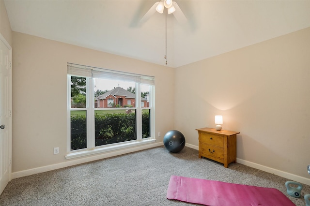 office space with carpet floors, vaulted ceiling, baseboards, and a ceiling fan