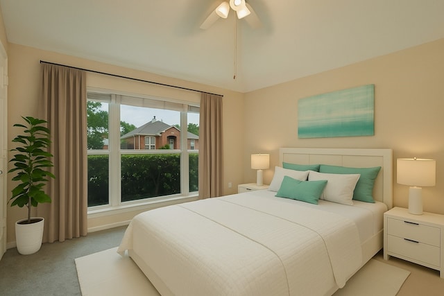bedroom featuring carpet flooring, baseboards, and ceiling fan