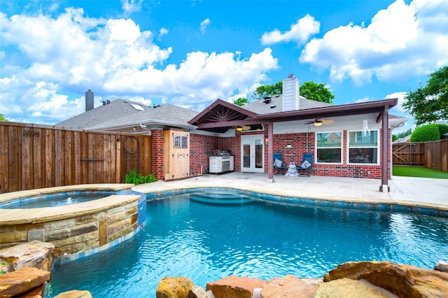 2309 Micarta Dr, Plano, TX 75025 - view of swimming pool featuring french doors, a patio area, a fenced backyard, a ceiling fan, and a pool with connected hot tub