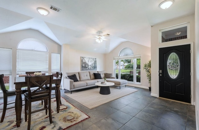 living room featuring lofted ceiling, a ceiling fan, and baseboards