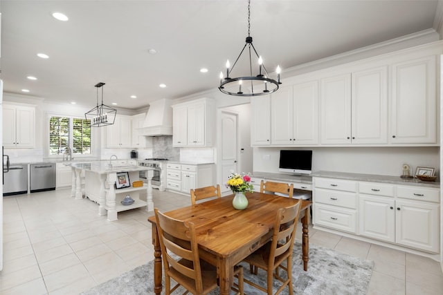dining room featuring a chandelier, ornamental molding, and light tile patterned floors