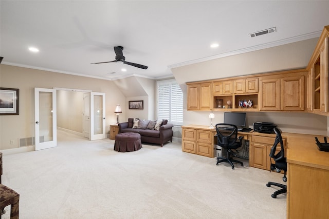 office featuring visible vents, a ceiling fan, built in study area, and crown molding