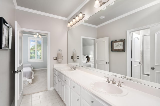 ensuite bathroom featuring a sink, ornamental molding, double vanity, and connected bathroom