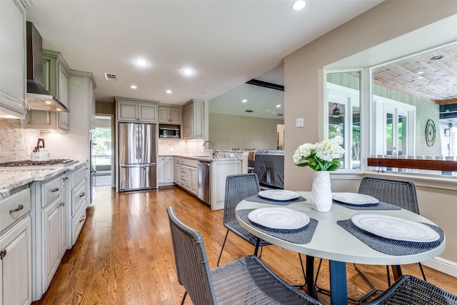 10907 Wonderland Trl, Dallas, TX 75229 - dining space with visible vents, recessed lighting, and light wood finished floors