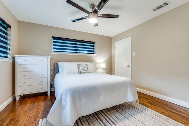 10907 Wonderland Trl, Dallas, TX 75229 - bedroom with ceiling fan, baseboards, visible vents, and wood finished floors