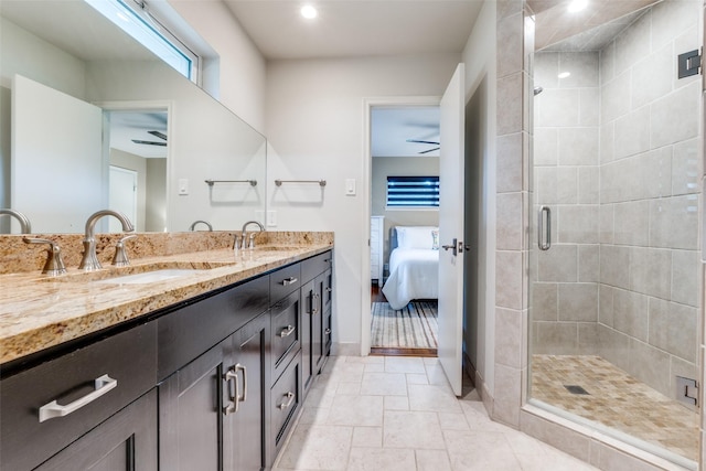 10907 Wonderland Trl, Dallas, TX 75229 - ensuite bathroom featuring a sink, connected bathroom, ceiling fan, and a stall shower