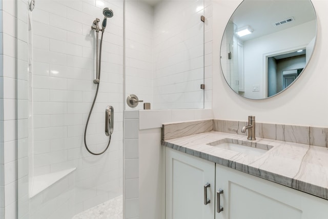 10907 Wonderland Trl, Dallas, TX 75229 - full bathroom featuring vanity, a tile shower, and visible vents