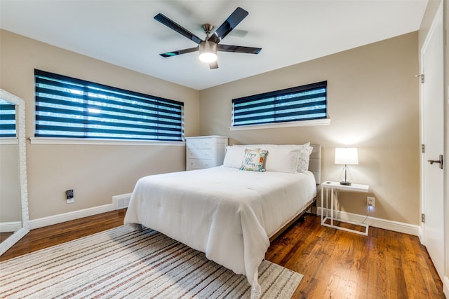 10907 Wonderland Trl, Dallas, TX 75229 - bedroom featuring a ceiling fan, baseboards, visible vents, and wood finished floors