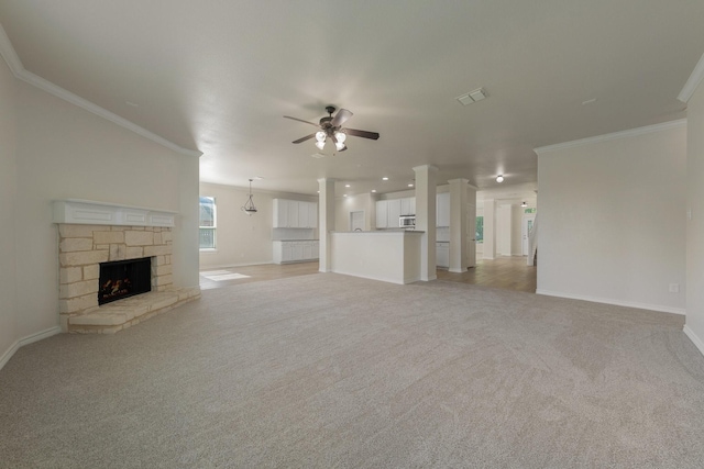 unfurnished living room featuring a ceiling fan, baseboards, and light carpet
