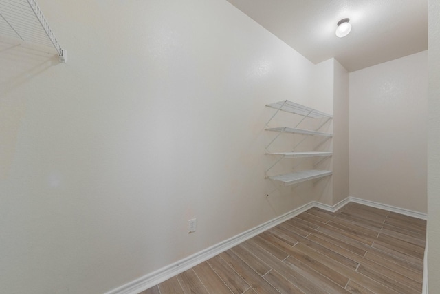 spacious closet with wood tiled floor