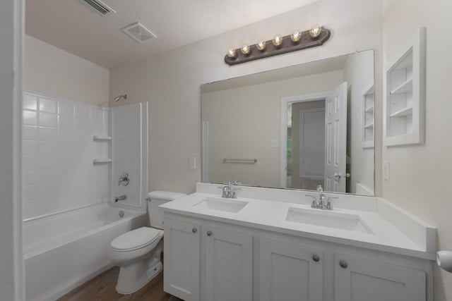 bathroom featuring a sink, shower / bathtub combination, toilet, and visible vents