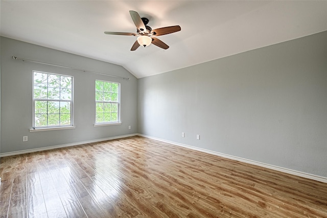2620 Argyle Shore Dr, Rockwall, TX 75087 - spare room featuring baseboards, ceiling fan, wood finished floors, and lofted ceiling