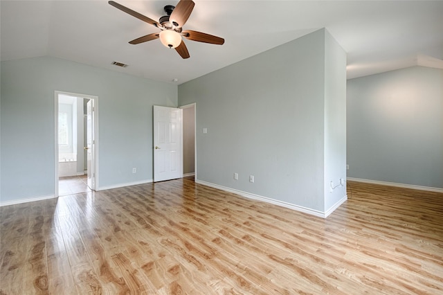 2620 Argyle Shore Dr, Rockwall, TX 75087 - interior space featuring visible vents, vaulted ceiling, wood finished floors, baseboards, and ensuite bathroom