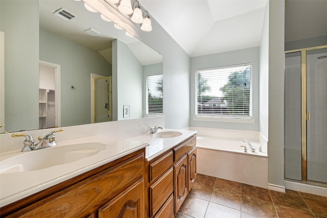 2620 Argyle Shore Dr, Rockwall, TX 75087 - bathroom featuring a sink, vaulted ceiling, a shower stall, and visible vents