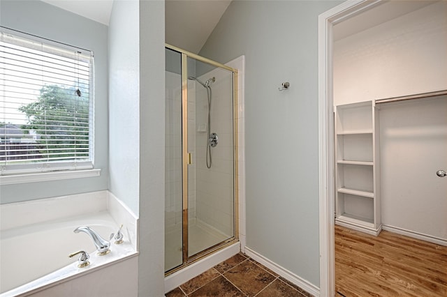 2620 Argyle Shore Dr, Rockwall, TX 75087 - bathroom featuring baseboards, a stall shower, a bath, and a wealth of natural light