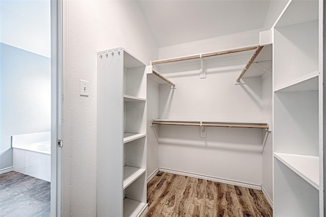 2620 Argyle Shore Dr, Rockwall, TX 75087 - walk in closet with wood finished floors