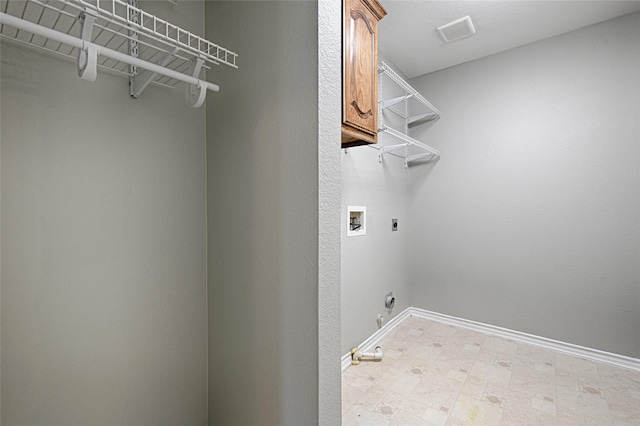 2620 Argyle Shore Dr, Rockwall, TX 75087 - washroom featuring cabinet space, hookup for a washing machine, baseboards, hookup for an electric dryer, and visible vents