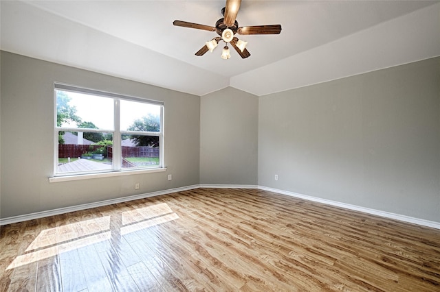 2620 Argyle Shore Dr, Rockwall, TX 75087 - unfurnished room with vaulted ceiling, baseboards, a ceiling fan, and wood finished floors