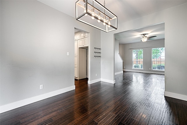 2620 Argyle Shore Dr, Rockwall, TX 75087 - interior space featuring baseboards, dark wood finished floors, and ceiling fan with notable chandelier