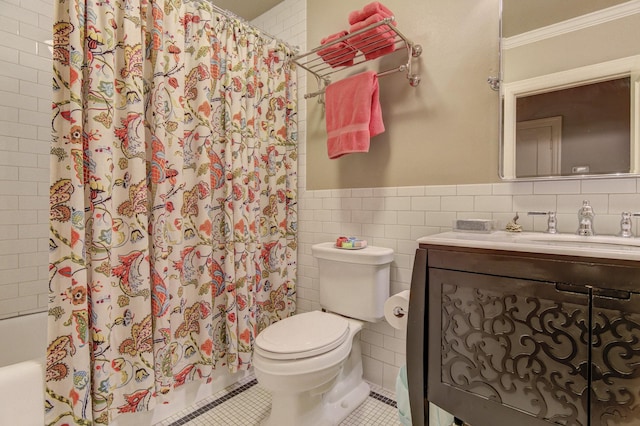 full bathroom with toilet, tile patterned floors, shower / bath combination with curtain, a wainscoted wall, and tile walls