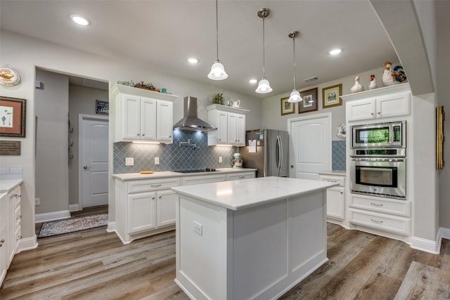 1314 Fleming Rd, Bells, TX 75414 - kitchen featuring light countertops, wall chimney exhaust hood, appliances with stainless steel finishes, and white cabinetry