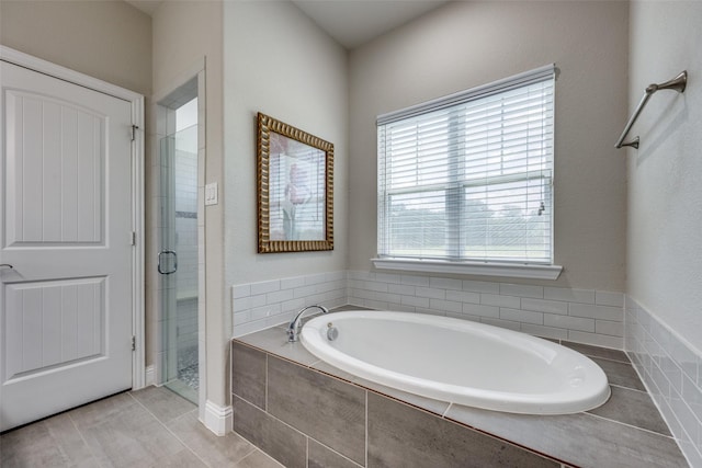 1314 Fleming Rd, Bells, TX 75414 - full bath featuring tile patterned floors, a stall shower, and a garden tub