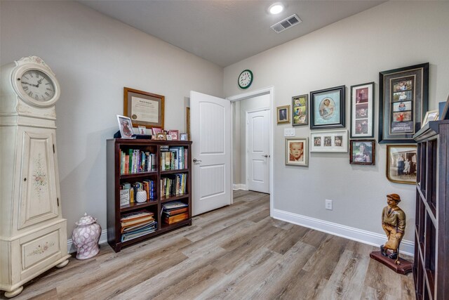 1314 Fleming Rd, Bells, TX 75414 - miscellaneous room featuring baseboards, visible vents, and light wood-style floors