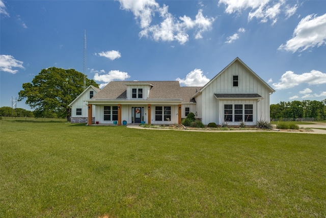 1314 Fleming Rd, Bells, TX 75414 - modern inspired farmhouse featuring a porch, a shingled roof, a front lawn, and board and batten siding