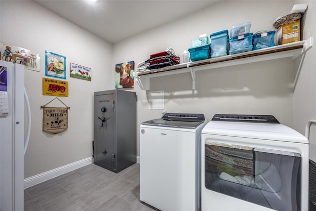 1314 Fleming Rd, Bells, TX 75414 - clothes washing area with laundry area, baseboards, and washer and dryer