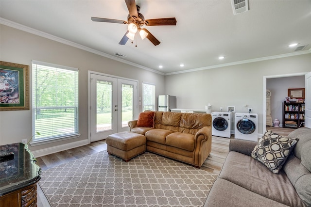 1314 Fleming Rd, Bells, TX 75414 - living room featuring independent washer and dryer, visible vents, plenty of natural light, and light wood-type flooring