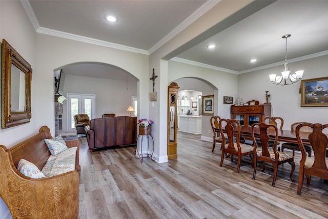 1314 Fleming Rd, Bells, TX 75414 - dining space with arched walkways, ornamental molding, and light wood-type flooring