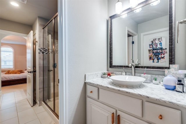 1110 Holford Dr, Frisco, TX 75036 - full bath featuring connected bathroom, vanity, tile patterned flooring, and a shower stall