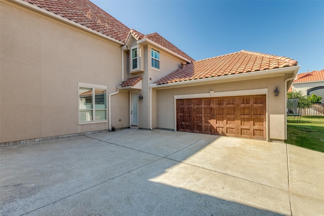1110 Holford Dr, Frisco, TX 75036 - view of front facade featuring concrete driveway, stucco siding, and a garage