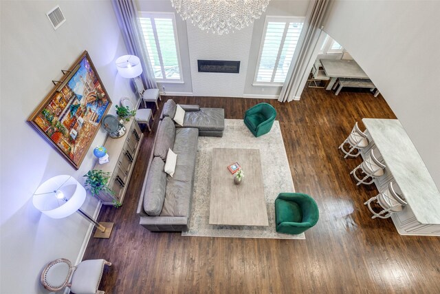 1110 Holford Dr, Frisco, TX 75036 - living room featuring a wealth of natural light, visible vents, a large fireplace, and wood finished floors